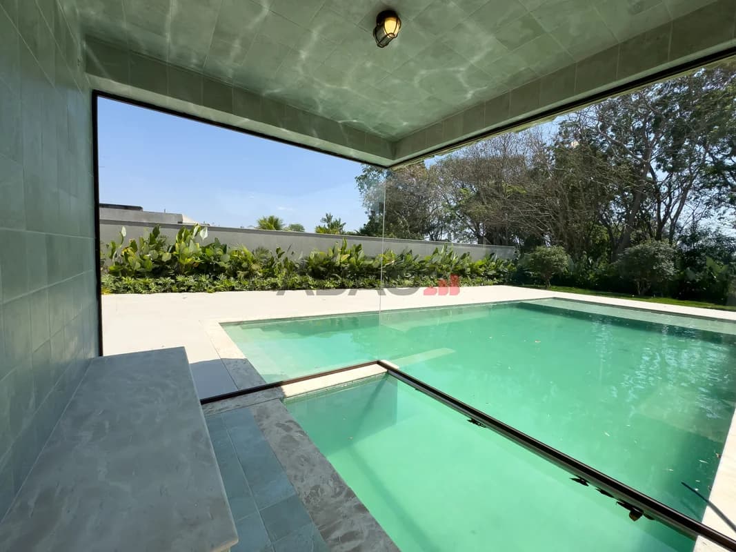 Fachada do Casa de Alto Padrão no Alphaville Cruzeiro | 586m² | 5 Suítes | Vista para a Mata